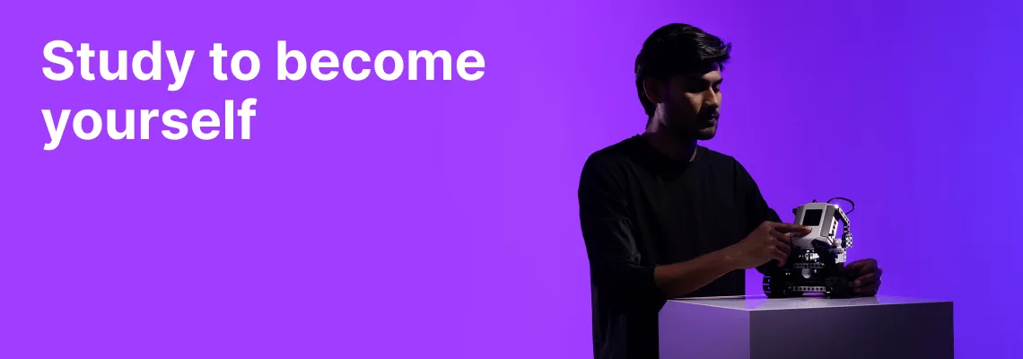 Study to become yourself - choose studies at KTU. International student from the Faculty of Electrical and Electronics in a vibrant purple hue background is working with a small robotics device.